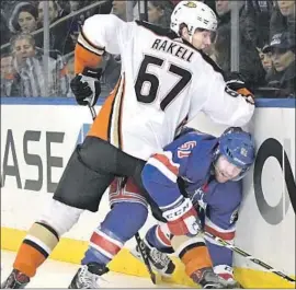  ?? Bill Kostroun Associated Press ?? RICKARD RAKELL and the Ducks can’t deliver a knockout against David Desharnais and the Rangers, who win their third straight behind good goaltendin­g.