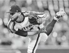  ?? Julio Cortez / Associated Press ?? Closer Roberto Osuna collected his 26th save of the season for the Astros by blanking the Orioles in the ninth inning.