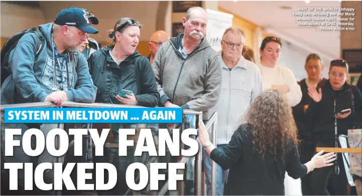  ?? Pictures: ALISON WYND ?? WAIT OF THE WORLD: Unhappy footy fans, including Joe and Maria Winiecki (below right), queue for finals tickets at GPAC yesterday.