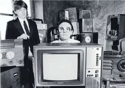  ?? Picture: REDFERNS ?? Geoff Downes and Trevor Horn of The Buggles pose with various radios and a television in London in June 1979.