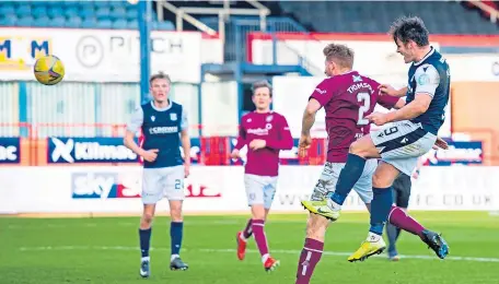  ??  ?? Dundee’s Danny Mullen heads home the opening goal