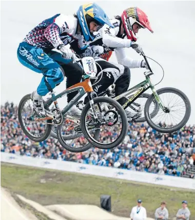  ??  ?? High flyer: Marc Willers, centre, during last year’s UCI BMX Supercross World Cup final at Papendal, the Netherland­s. Photo: Supplied