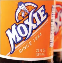  ?? The Associated Press ?? Bottles of the soft drink Moxie are pictured in West Bath, Maine. Soft drink giant Coca-Cola said Tuesday, it is acquiring Moxie, a beloved New England soda brand that is the official state beverage of Maine.