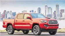  ?? Toyota photo ?? The TRD Sport has its own grille and is the only Tacoma with a hood scoop and 17-inch wheels. This Double Cab (Toyota’s term for crew cab) is draped in Inferno, one of three new paint colors for 2016.