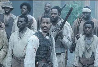  ?? FOX SEARCHLIGH­T PICTURES ?? Nate Parker, centre, co-wrote, directs and stars in The Birth of a Nation, a vital film, visceral in nature and eager to engage the viewer with its story of a slave rebellion.