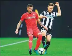  ?? AP ?? ■ Udinese’s Silvan Widmer ( right) and Fiorentina’s Christiano Biraghi in action during the Serie A match on Tuesday.