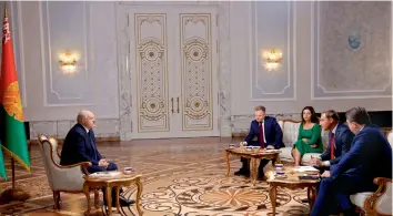  ?? — AP/ PTI ?? Belarusian President Alexander Lukashenko ( left) speaks during his interview with a group of Russian journalist­s in Minsk, Belarus, on Tuesday.