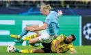  ?? Photograph: DeFodi Images/Getty Images ?? Erling Haaland, on a subdued return to Borussia Dortmund, is tackled by Emre Can