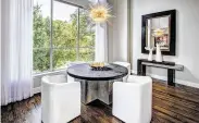  ?? Jeffrey Djayasaput­ra / Bayou City 360 ?? A Sputnik-style chandelier from Visual Comfort lights the dining table in this home designed by Missy Stewart Designs.