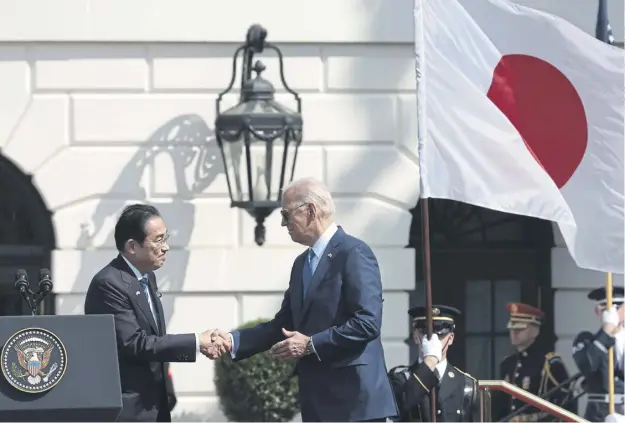  ?? ?? President Joe Biden, right, shakes hands with Japanese Prime Minister Fumio Kishida during an arrival ceremony at the White House yesterday