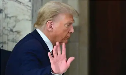  ?? Angela Weiss/AFP/Getty Images ?? Donald Trump waves after speaking to the media during the third day of his civil fraud trial in New York on Wednesday. Photograph: