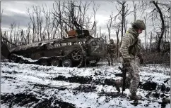  ?? ?? The hulk of a Russian tank after a Ukrainian counter-attack