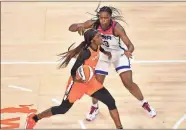  ?? Stephen R. Sylvanie-USA TODAY Sports ?? WNBA All Star guard Kahleah Copper (front) dribbles against Team USA center Sylvia Fowles during the WNBA All Star Game.