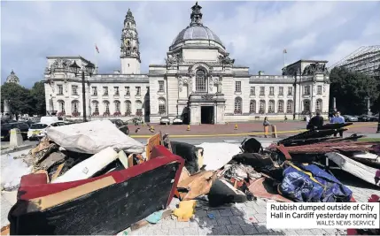  ?? WALES NEWS SERVICE ?? Rubbish dumped outside of City Hall in Cardiff yesterday morning