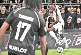  ?? — AFP photo ?? Retired Jamaican Olympic and World champion sprinter Usain Bolt takes part in an exhibition football game organised by watchmaker Hublot during the press day on the eve of the opening of the Baselworld watch and jewellery show on March 21, 2018 in Basel.