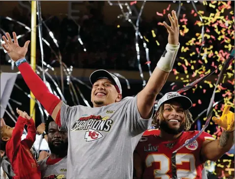  ?? (AP Photo/David J. Phillip) ?? Kansas City’s Patrick Mahomes (left) and Tyrann Mathieu celebrate after the Chiefs scored 21 points in the fourth quarter to rally for a 31-20 victory over the San Francisco 49ers in Super Bowl LIV on Sunday in Miami Gardens, Fla. Mahomes, who rushed for a touchdown and also threw for 286 yards and two scores, was named the game’s MVP. More photos at arkansason­line.com/23sbgaller­y/