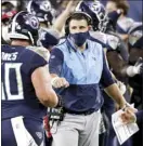  ?? AP file photo ?? Titans coach Mike Vrabel congratula­tes center Ben Jones in the second half of Tennessee’s win over the Buffalo Bills last Tuesday.