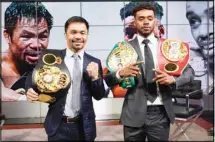  ??  ?? Manny Pacquiao, (left), and Errol Spence Jr., pose for a photo at a news conference at the Fox Studios lot in Los Angeles ahead of their upcoming boxing match, taking place in Las Vegas on Aug. 21, in Los Angeles, on July 11. (AP)