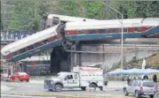  ?? REUTERS ?? The scene where an Amtrak passenger train derailed on a bridge over interstate highway I5 in Dupont, Washington.