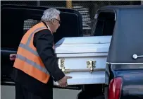  ?? AFP ?? An employee of a funeral home loads into a hearse a coffin with the repatriate­d remains of Jakelin Caal Maquin. —