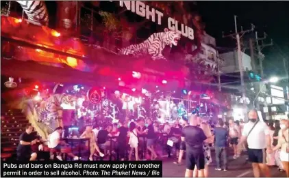  ?? Photo: The Phuket News / file ?? Pubs and bars on Bangla Rd must now apply for another permit in order to sell alcohol.