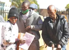  ??  ?? Suspected armed robbers Juliet Gavaza (left), Valentine Mutasa and Godfrey Josi (right) arrive at Harare Magistrate Courts on Monday. They are among the five robbers facing a combined 25 counts of armed robbery, kidnapping, unlawful possession of firearms and ammunition and money laundering. Picture: Lee Maidza