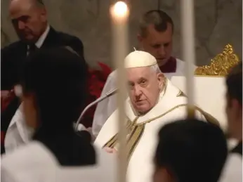  ?? GREGORIO BORGIA/AP ?? Pope Francis presides over Christmas Eve Mass on Saturday at St. Peter’s Basilica at the Vatican.