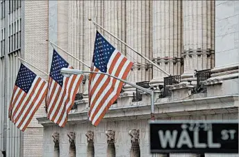  ?? BRYAN R. SMITH/GETTY-AFP ?? A recent poll found just 31 percent of people look favorably on executives and Wall Street.