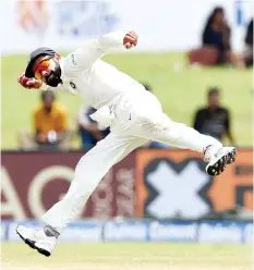  ?? — AFP photo ?? Indian cricket team captain Virat Kohli throws a ball during the fourth day of the first Test match between Sri Lanka and India at Galle Internatio­nal Cricket Stadium in Galle on July 29, 2017.