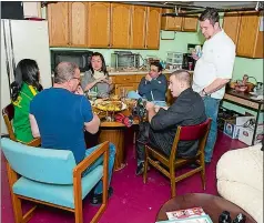  ?? SUBMITTED ?? Chef Robert Irvine (in blue shirt, with back to camera) and his crew hang out backstage in the Garde Arts Center’s Green Room in 2012.