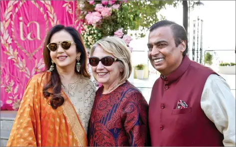  ?? RELIANCE HANDOUT/IANS ?? Reliance Industries chairman Mukesh Ambani and his wife Nita Ambani receive former US First Lady and former US Secretary of State, Hillary Clinton on her arrival at the pre-wedding function of their daughter Isha Ambani with Anand Piramal, in Udaipur, Rajasthan, on Saturday. Former head of advertisin­g giant WPP, Martin Sorrell, BP Group CEO Bob Dudley, Huffington Post founder Arianna Huffington, 21st Century Fox CEO James Murdoch and Saudi Energy Minister Khalid Al-Falih, among others, are also invited.