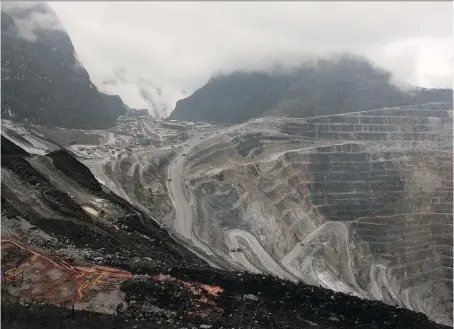  ?? OLIVIA RONDONUWU/AFP/GETTY IMAGES FILES ?? Indonesia’s remote Papua province is home to Freeport-McMoRan’s Grasberg mining complex. Many mining firms with assets in emerging economies are talking about diversifyi­ng their risks as the countries also want to profit from metal’s surge.