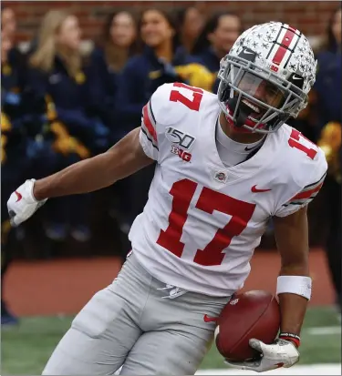  ?? PAUL SANCYA — THE ASSOCIATED PRESS ?? Ohio State’s Chris Olave celebrates a touchdown reception against Michigan in 2019.