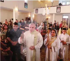  ??  ?? BAGHDAD: Iraqi Christians celebrate Easter at Mar Youssif Chaldean Church. —AP