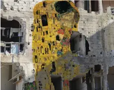  ?? Ayyam Gallery ?? Tammam Azzam’s Freedom Graffiti work features Gustav Klimt’s The Kiss superimpos­ed on to a bombed building