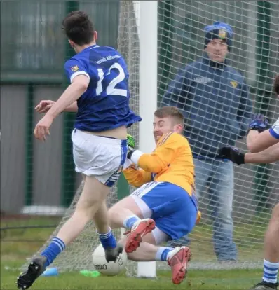  ??  ?? Joe O’Donoghue, Dundalk Gaels blocks Darragh McConnon’s shot on goals for St. Mary’s. Pictures: Ken Finegan