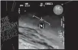  ?? The Associated Press ?? In this image made from video, an unidentifi­ed object moves near a Navy plane in the air.