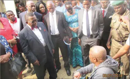  ??  ?? Minister of Health, Professor Issac Adewole (left), discussing with one of the Libya returnees, Eze Benedict, who lost both legs while in Libya in Port Harcourt...yesterday