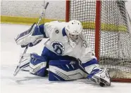  ?? Dave Stewart/Hearst Connecticu­t Media ?? Darien's goalie Finley Hegerty covers the puck against Greenwich during the FCIAC boys ice hockey semifinals at the Darien Ice House on Wednesday.