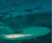  ?? MARK KOLBE — GETTY IMAGES ?? A 2012 aerial uiev of Wlasoff Cay, a sand island in the Great Barrier Reef in North Queensland, Australia.