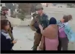  ?? (YouTube) ?? AHED TAMIMI (right) and a woman hit a soldier in Nabi Saleh last Friday, trying to provoke a violent reaction.