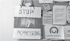  ?? ?? A placard reads ‘Stop Repression­s’ and ‘Polish help’ on a wall at the Belarusian Solidarity Centre in Warsaw, Poland.
