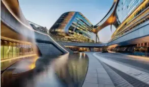  ??  ?? November 26, 2015: Sky SOHO, designed by Iraqi-british architect Zaha Hadid, in Shanghai. With a gross floor area of 350,000 square meters, it is comprised of 12 stand-alone buildings interlinke­d by 16 sky bridges to create a network of spaces. IC
