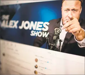  ?? Eric Baradat / AFP/Getty Images ?? A screen shot displaying the Twitter account of far-right conspiracy theorist Alex Jones. Jones is accused of deleting posts related to the Sandy Hook lawsuit against him.