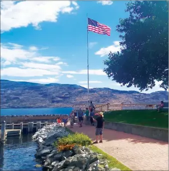  ??  ?? File photo
Peachland was portrayed as an American town, complete with Old Glory flying over the waterfront, during the shooting of a movie this fall,