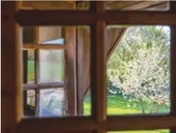  ??  ?? Ci-dessus : face à la literie, évidemment fleurie, les fenêtres s'ouvrent sur les pommiers en fleurs. Ci-dessous : une table conviviale et fleurie au coin du feu résume l'esprit de la maison.