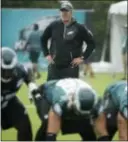  ?? THE ASSOCIATED PRESS ?? Eagles coach Doug Pederson had the team in pads and hitting on Tuesday as he tries to prepare them for the upcoming season.