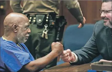  ?? Mark Boster Los Angeles Times ?? ANDREW WILSON, left, has filed a lawsuit against a now-retired LAPD detective, the city of L.A. and the county for his wrongful conviction in a 1984 stabbing death. Wilson, 63, was freed from his life sentence in 2017.