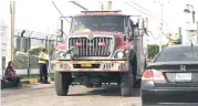  ?? IAN ALLEN/PHOTOGRAPH­ER ?? Fire truck leaving the Petrojam refinery along Marcus Garvey Drive in Kingston after putting out a fire there yesterday morning.
