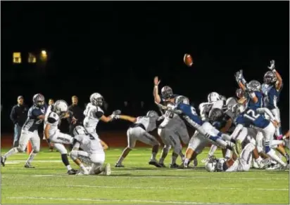  ?? PETE BANNAN — DIGITAL FIRST MEDIA ?? Episcopal Academy’s Connor Ringwalt kicks a last-second field goal Friday night that gives the Churchmen a 37-34 victory over host Malvern Prep. EA coach Todd Fairlie said later he had no doubt about Ringwalt coming through in the clutch.